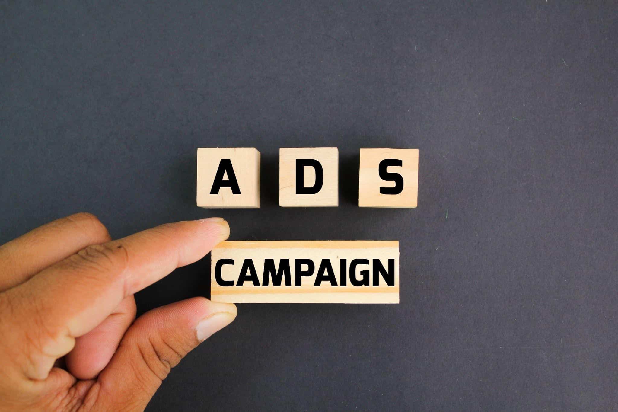 Digital marketing ads campaign concept with wooden blocks spelling ADS and CAMPAIGN, symbolizing PPC and paid advertising strategies in St. Petersburg.